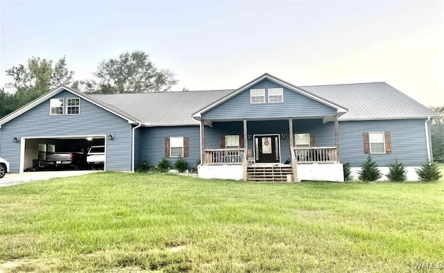 view of front of home with a front lawn, a porch, and a garage