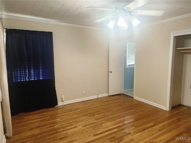 2417 Dvorak Cir, Linden, AL 36748 - unfurnished bedroom featuring crown molding, wood finished floors, and ceiling fan