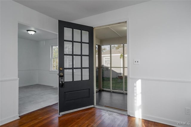 doorway to outside with dark wood-type flooring