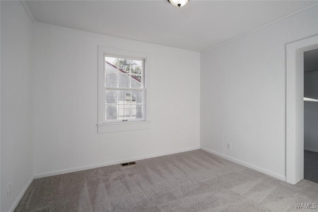 unfurnished bedroom with light colored carpet