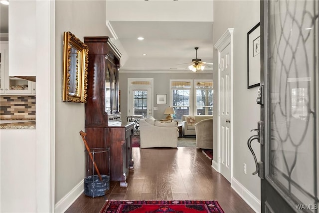 foyer with ceiling fan, dark wood-style flooring, recessed lighting, and baseboards