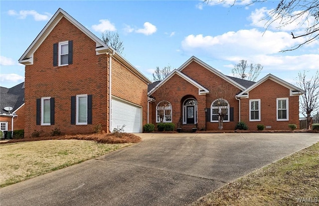 view of front of property featuring driveway, a garage, a front lawn, and brick siding