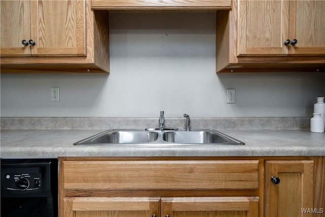 1212 12th St Unit 23, Tuscaloosa, AL 35401 - kitchen featuring black dishwasher, a sink, and light countertops