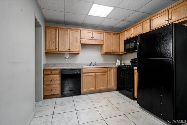 1212 12th St Unit 23, Tuscaloosa, AL 35401 - kitchen with black appliances, a sink, a drop ceiling, and light countertops