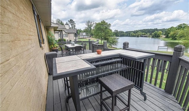 16584 Kathryn Lane Dr, Northport, AL 35475 - wooden deck with a water view and outdoor dining area