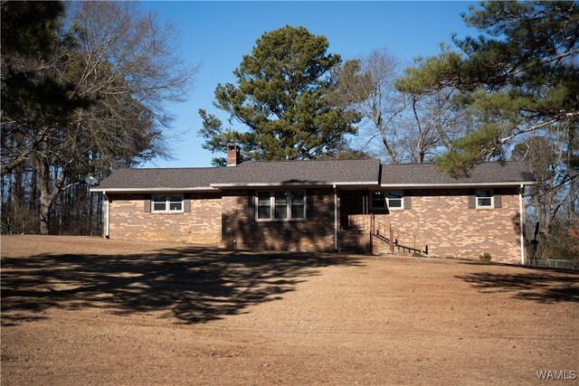 ranch-style home with a front yard