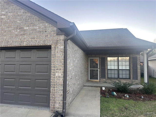 doorway to property featuring a garage