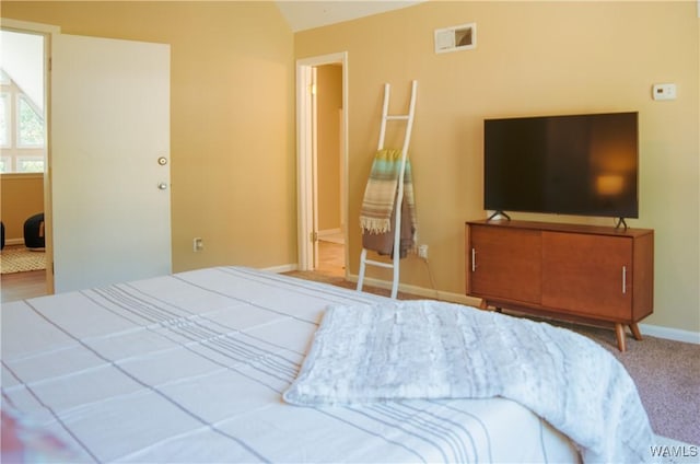 bedroom with carpet and baseboards