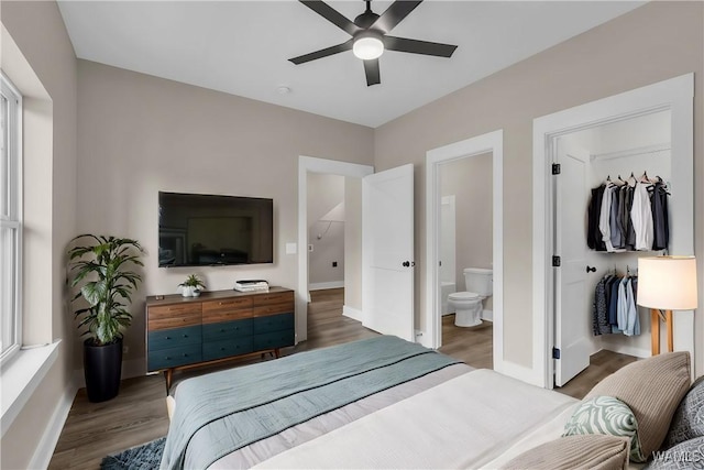 bedroom featuring connected bathroom, hardwood / wood-style floors, and ceiling fan