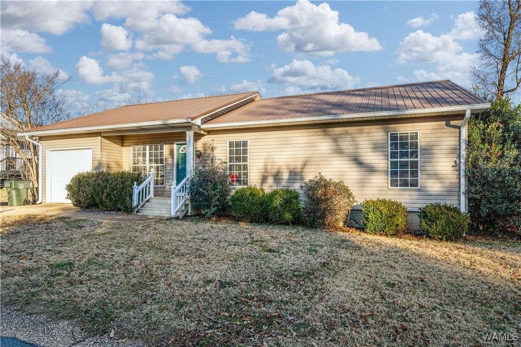 ranch-style house featuring a garage