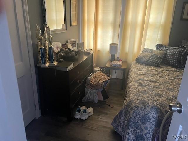 bedroom with wood finished floors