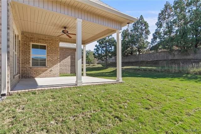 view of yard featuring ceiling fan and a patio area