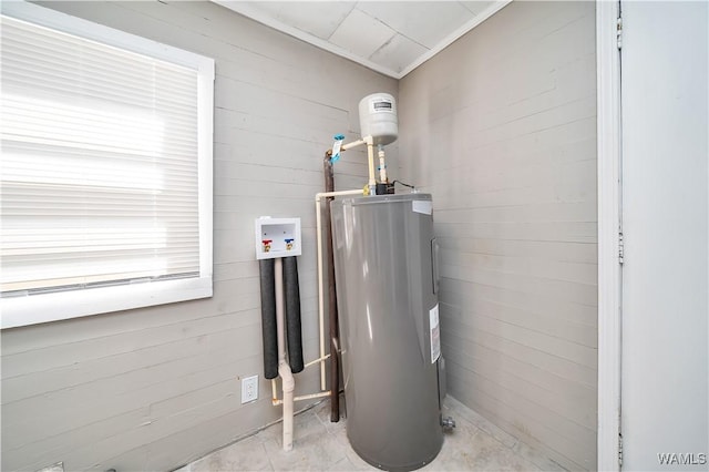utility room with electric water heater