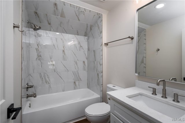bathroom with toilet, shower / bathtub combination, and vanity