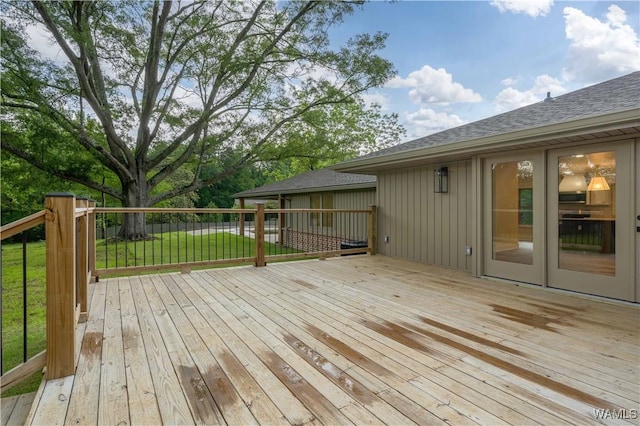 wooden terrace with a yard
