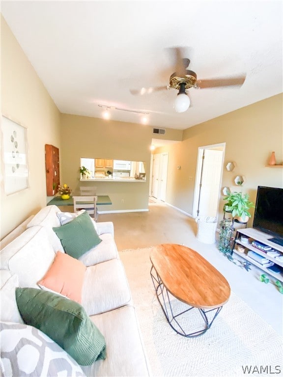 living room with light colored carpet and ceiling fan