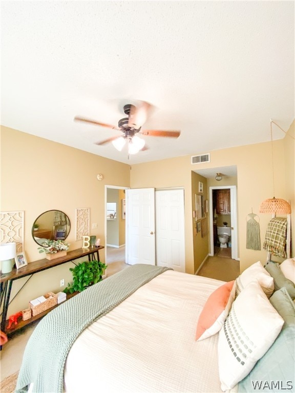 bedroom with ceiling fan, carpet floors, and a closet