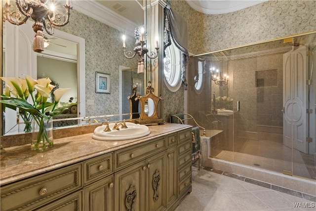 bathroom with vanity, tile patterned floors, walk in shower, and ornamental molding