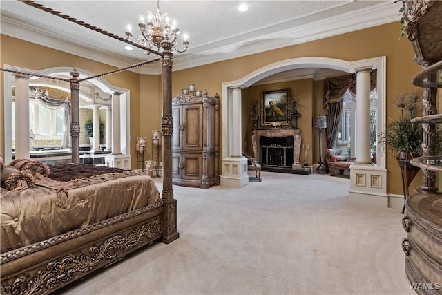 carpeted bedroom featuring ornate columns, ornamental molding, and an inviting chandelier