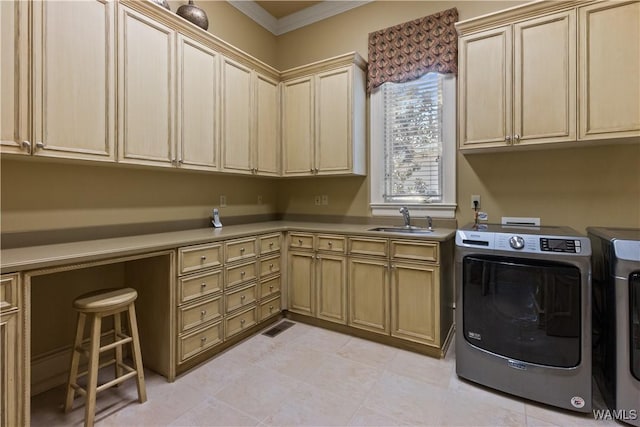 laundry area with cabinets, independent washer and dryer, crown molding, and sink