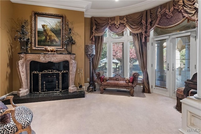 living area with a wealth of natural light, a fireplace, and carpet floors