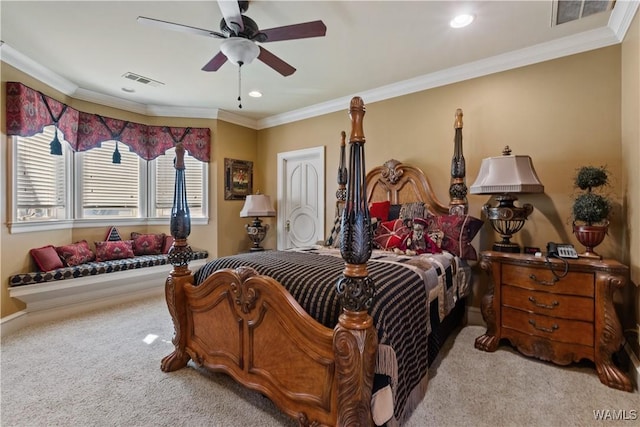 carpeted bedroom featuring ceiling fan and ornamental molding