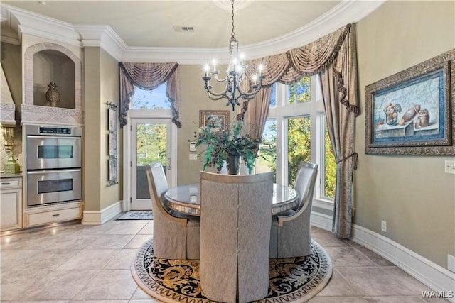 dining room with crown molding, light tile patterned floors, and a chandelier