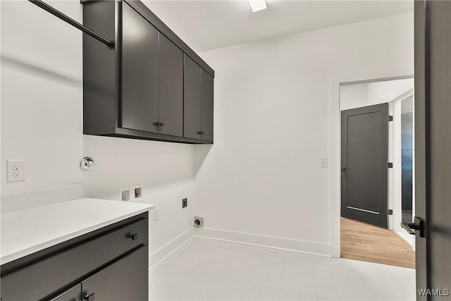 laundry area featuring cabinets, washer hookup, and hookup for an electric dryer