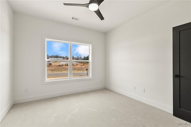 unfurnished room featuring ceiling fan and light colored carpet