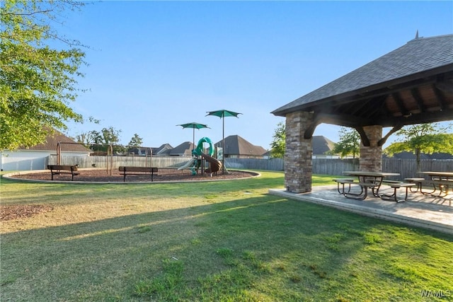 view of home's community with a gazebo, a lawn, a patio, and a playground