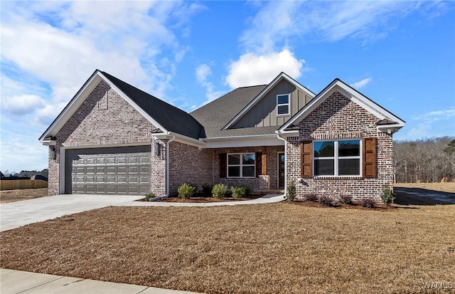 view of front of home with a garage and a front lawn