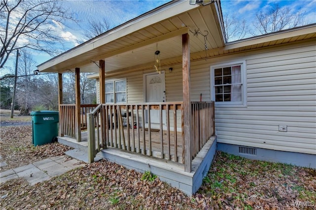 entrance to property with a porch