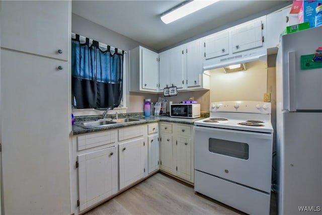 kitchen with light hardwood / wood-style floors, sink, white appliances, and white cabinets