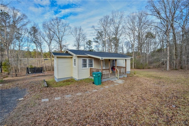 exterior space with covered porch and a trampoline