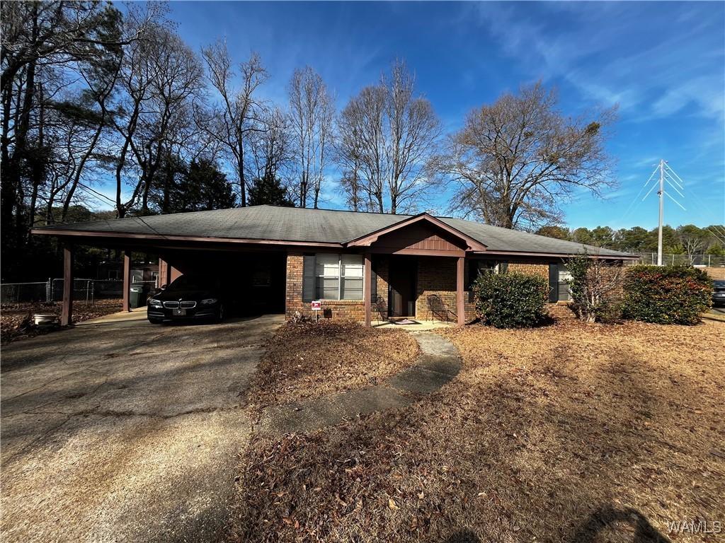 view of front of property with a carport