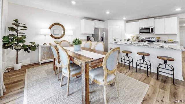 dining room featuring light hardwood / wood-style flooring