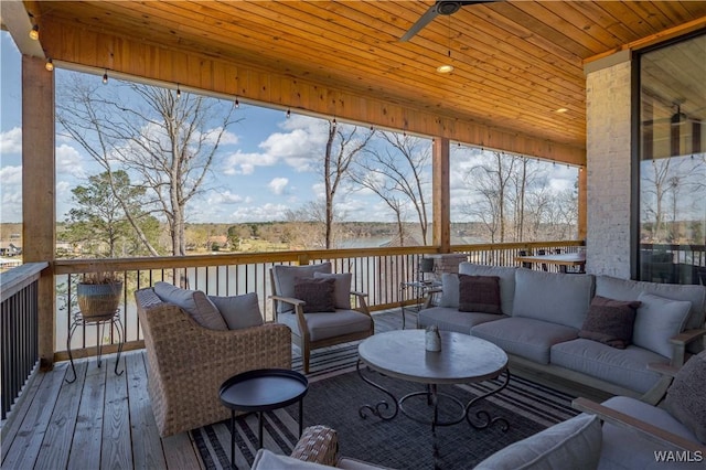 sunroom with an outdoor hangout area and ceiling fan