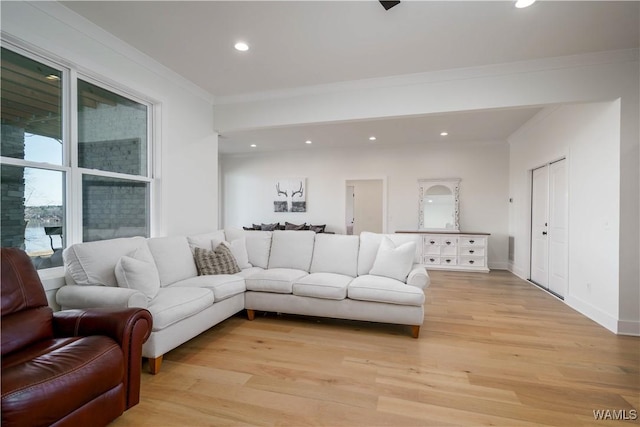 living area featuring recessed lighting, baseboards, light wood-style floors, and ornamental molding