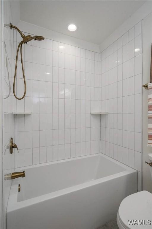 bathroom featuring toilet and shower / bathtub combination