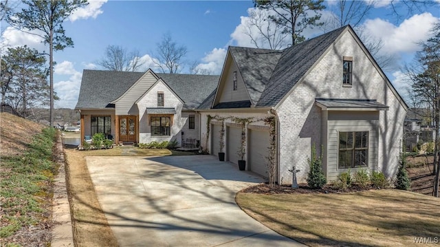 view of front of property featuring brick siding, concrete driveway, and a garage