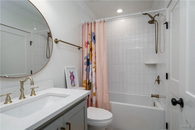 bathroom featuring recessed lighting, toilet, vanity, and shower / bath combo