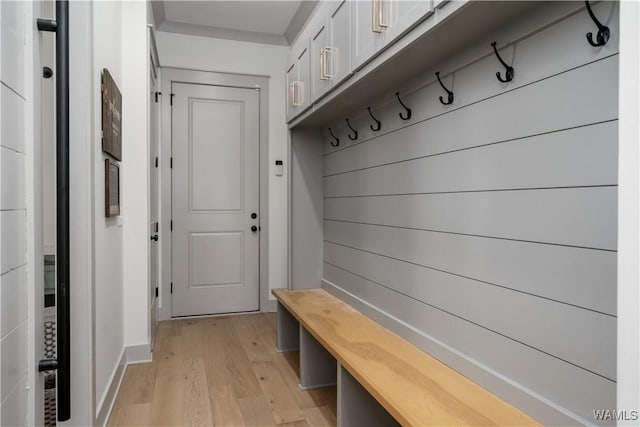 mudroom with light wood finished floors