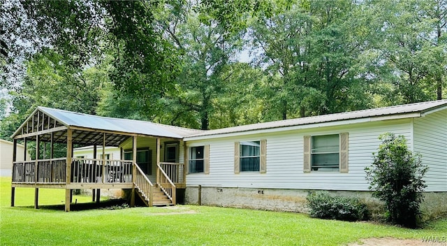 11624 Summer Chase Rd, Mccalla, AL 35111 - view of front of home with a front lawn, a metal roof, a wooden deck, and stairway
