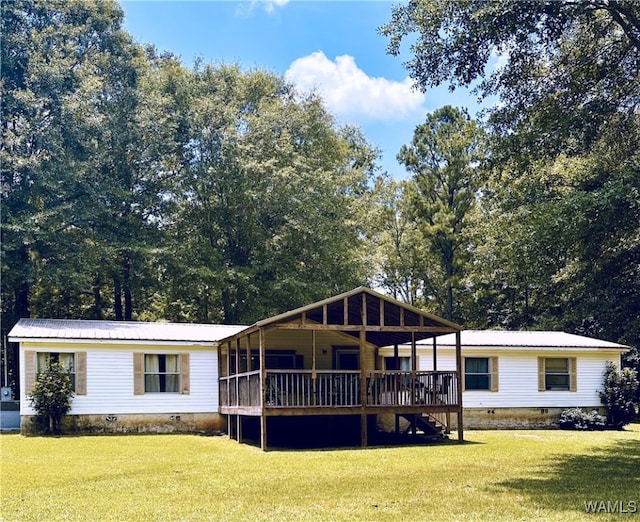 11624 Summer Chase Rd, Mccalla, AL 35111 - view of front of house with crawl space, a front lawn, a wooden deck, and a metal roof