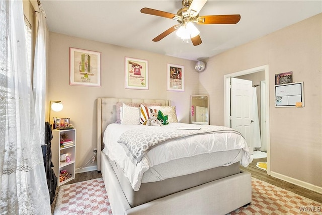 bedroom with hardwood / wood-style floors and ceiling fan