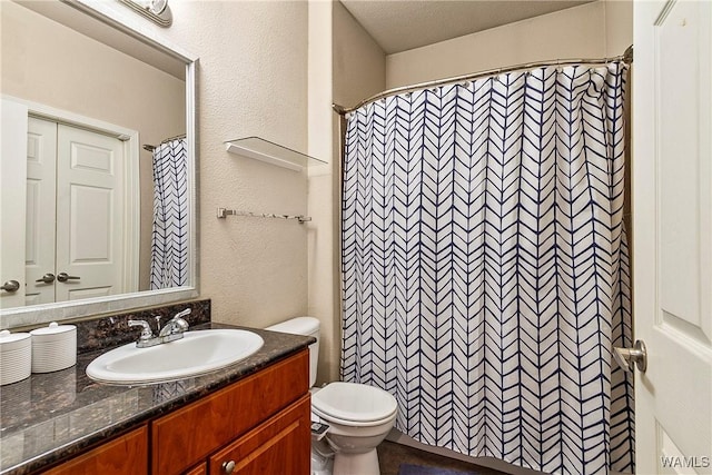 bathroom with vanity, toilet, and a shower with shower curtain