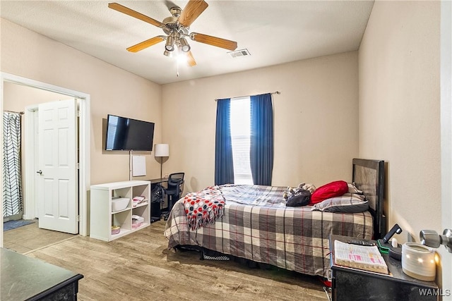 bedroom featuring hardwood / wood-style flooring and ceiling fan