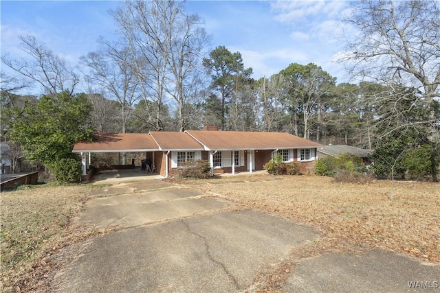 ranch-style home with a carport