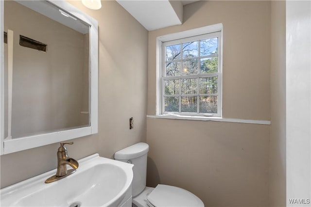 bathroom with sink and toilet