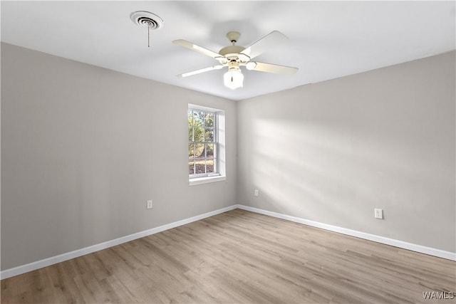 unfurnished room with ceiling fan and light wood-type flooring